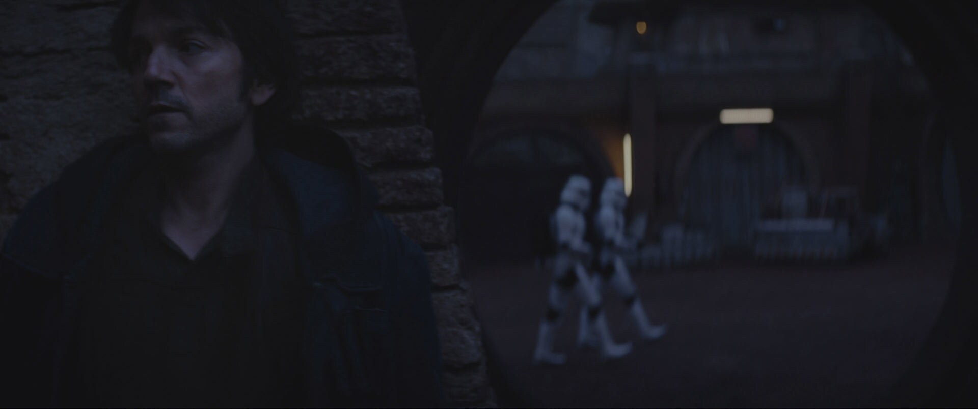 Cassian Andor performing tasks under the Empire’s watchful agents